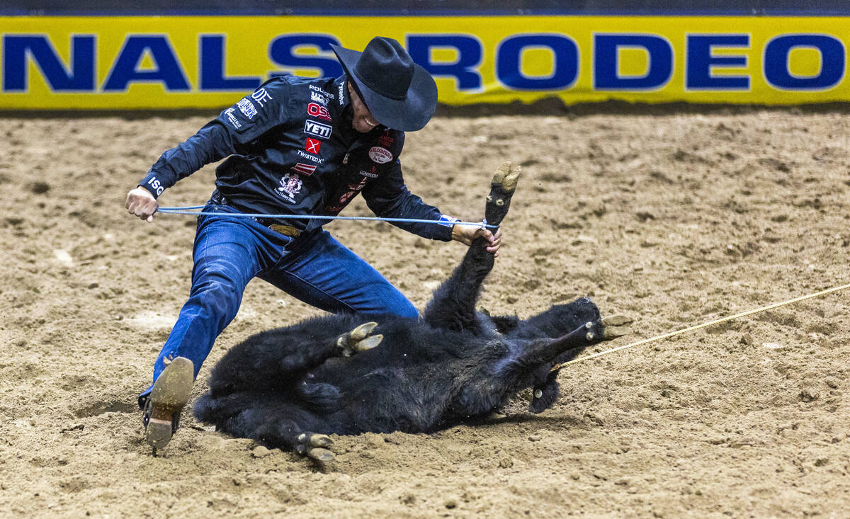 Shad Mayfield secures a calf on the way to a tying win in Tie-Down Roping during Day 2 of Natio ...