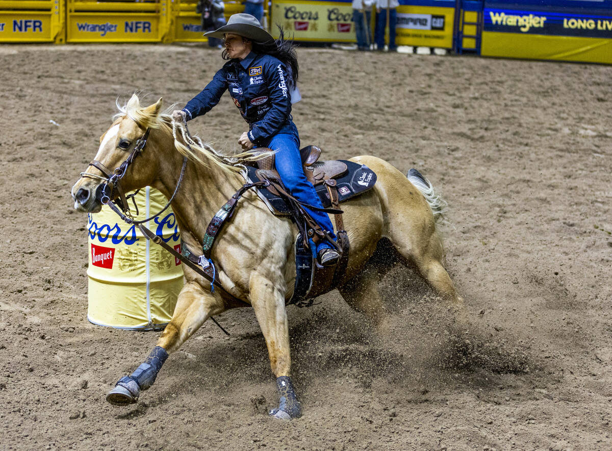 Hailey Kinsel digs in on turn one on her way to a win in Barrel Racing during Day 2 of National ...