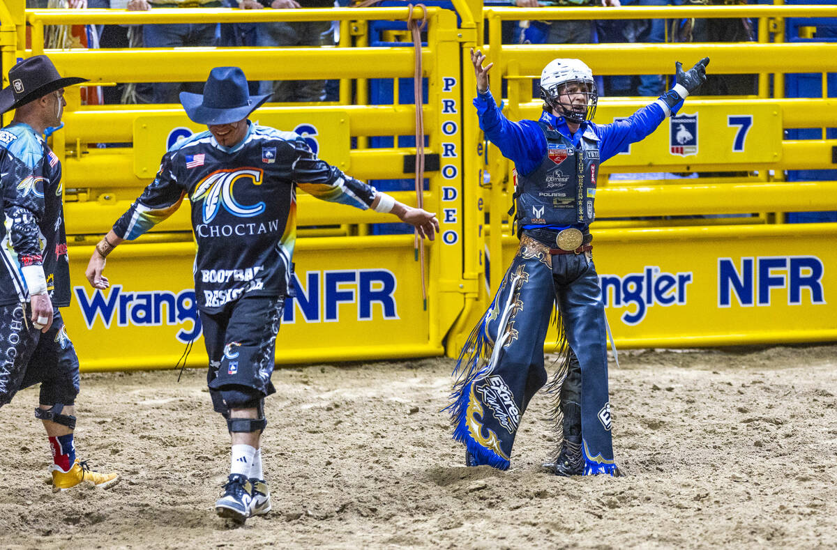 Stetson Wright celebrates a winning ride on Orbit in Bull Riding during Day 2 of National Final ...