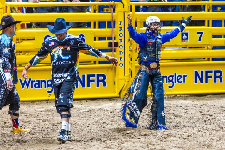 Stetson Wright celebrates a winning ride on Orbit in Bull Riding during Day 2 of National Final ...