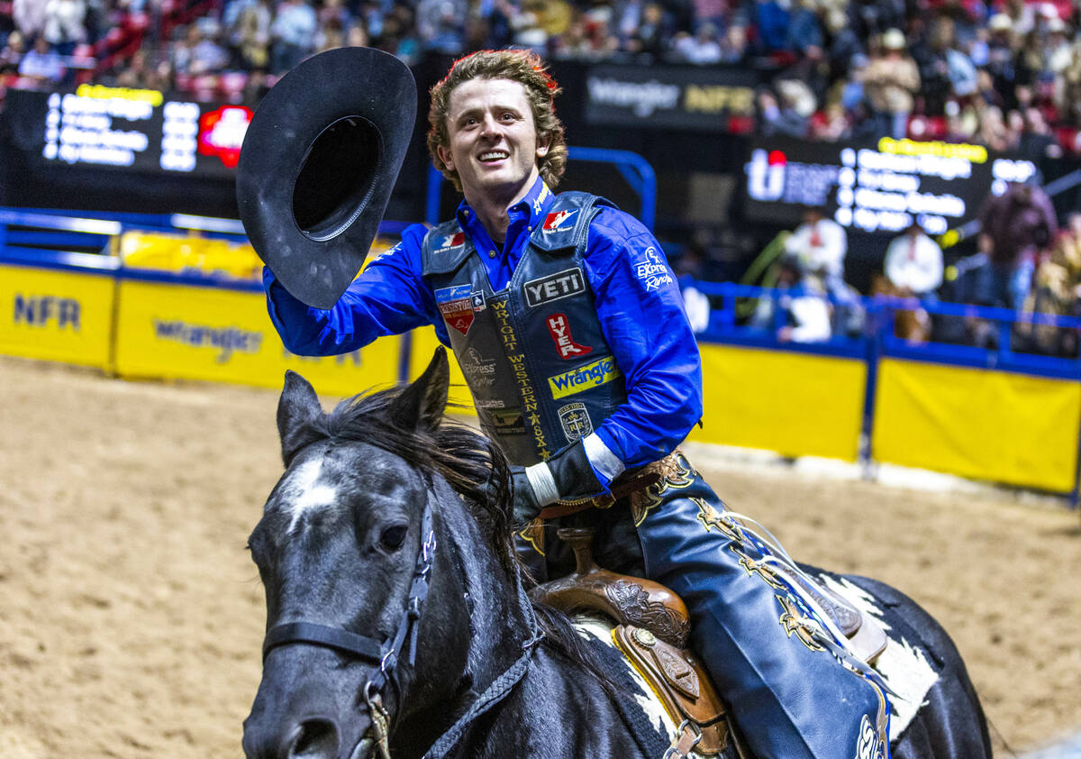 Stetson Wright celebrates a winning ride on Orbit in Bull Riding during Day 2 of National Final ...