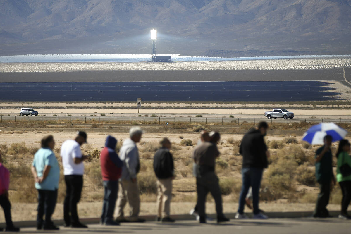 The Ivanpah Solar Electric Generating System is seen in the distance as hundreds line up outsid ...