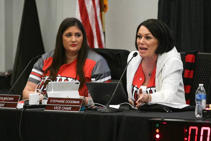 Nevada System of Higher Education Regent Heather Brown listens as fellow Regent Stephanie Goodm ...