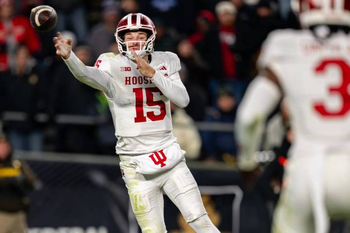 Indiana quarterback Fernando Mendoza (15) makes a pass during an NCAA college football game aga ...