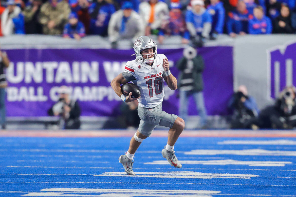 UNLV quarterback Anthony Colandrea (10) scramble with the ball against Boise State in the first ...
