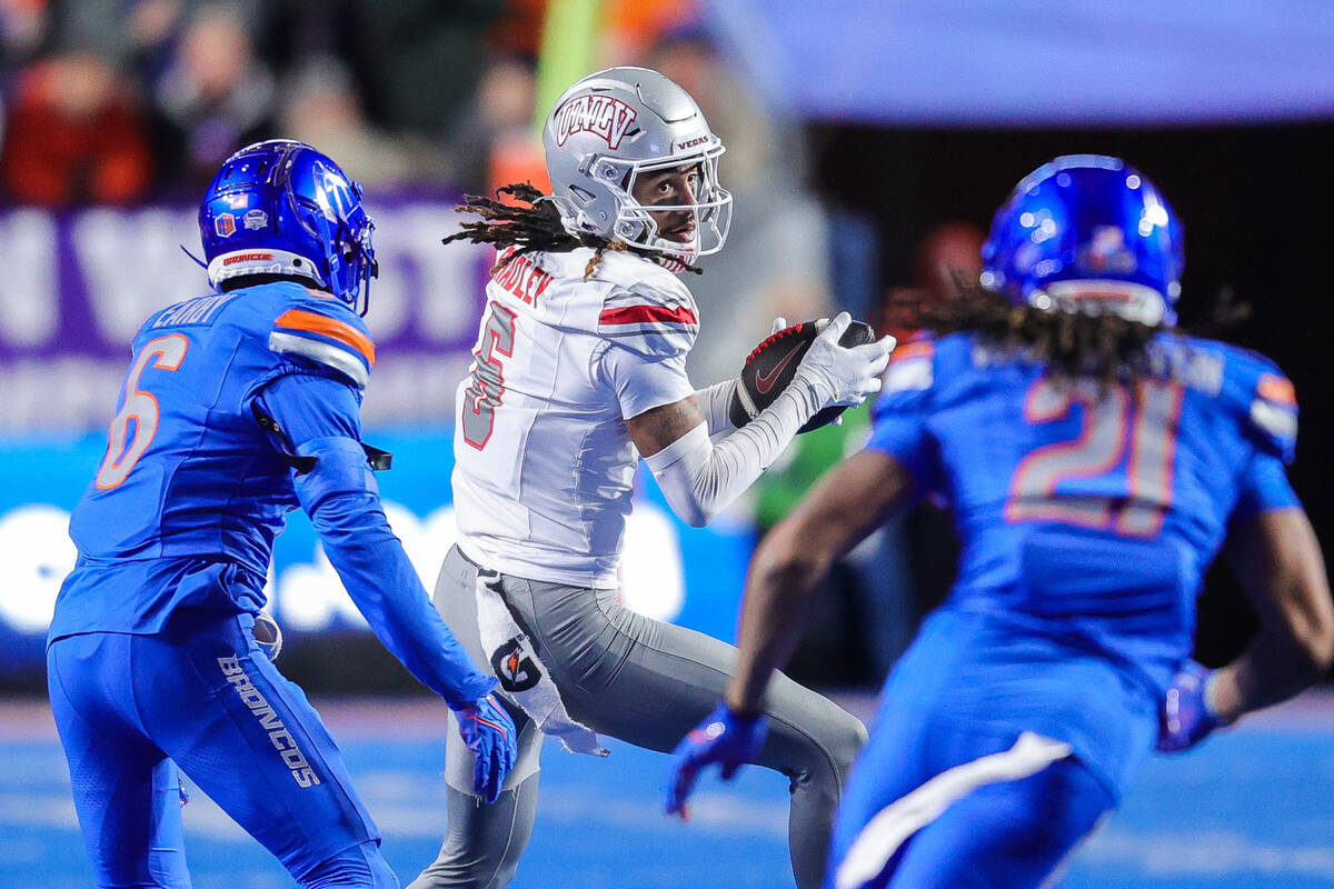 UNLV wide receiver Jaden Bradley (6) turns up field after a catch in front of Boise State corne ...