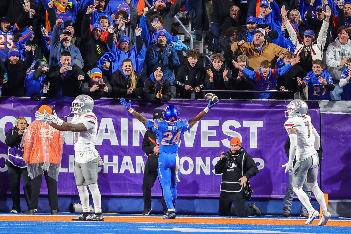 Boise State running back Dylan Riley (24) celebrates in front of his home fans after a 9 yard t ...