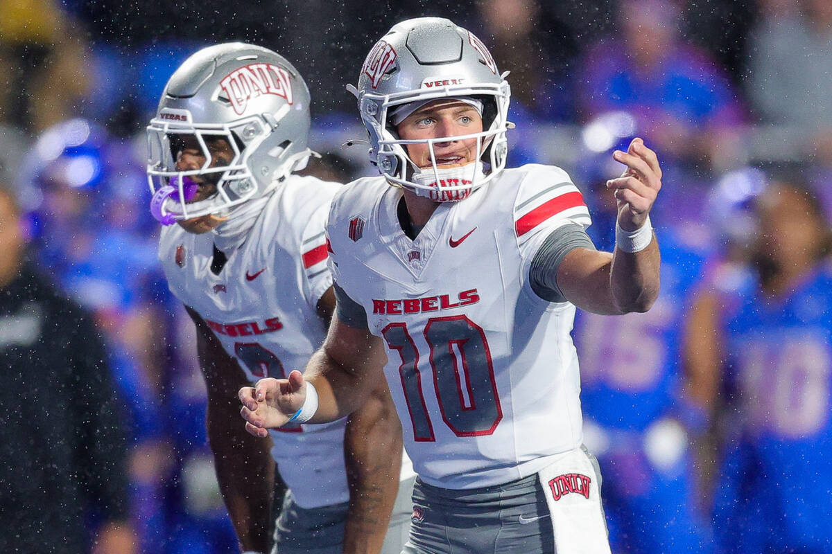 UNLV quarterback Anthony Colandrea (10) signals for a receiver to go in to motion before the sn ...