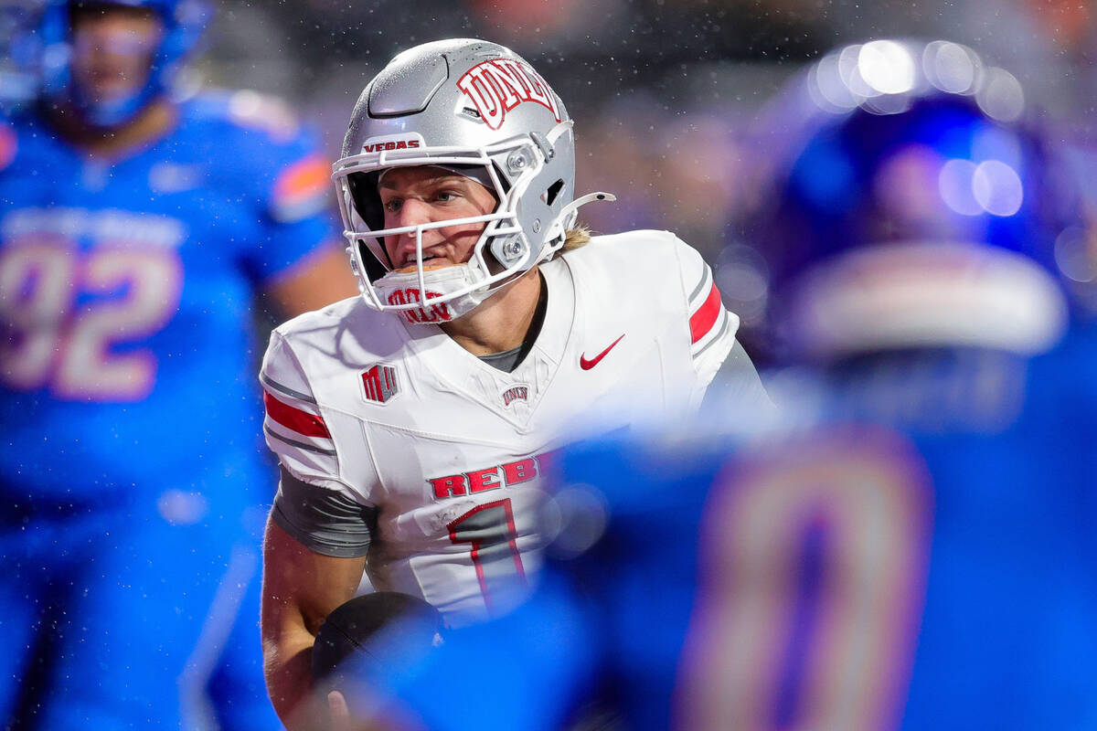 UNLV quarterback Anthony Colandrea cuts inside of the Boise State defense for a 5-yard touchdo ...