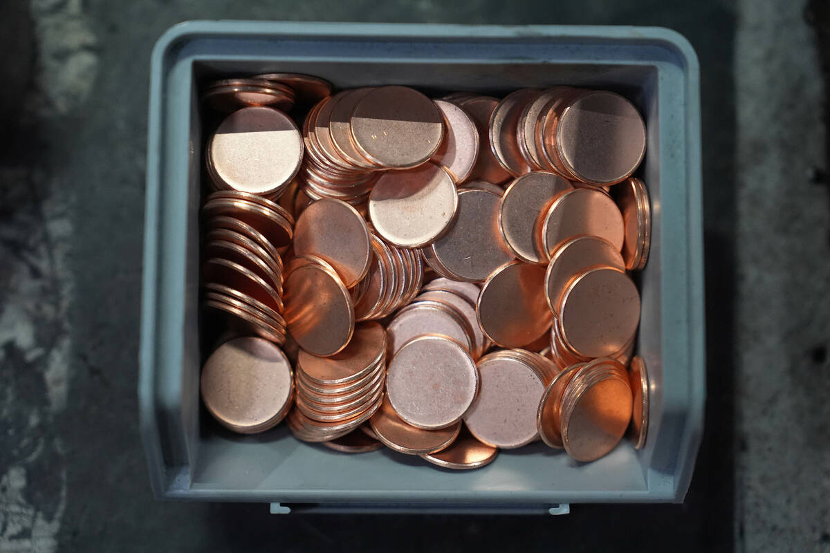 Blank coins wait to be the last pennies pressed at the U.S. Mint in Philadelphia, Wednesday, No ...