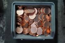 Blank coins wait to be the last pennies pressed at the U.S. Mint in Philadelphia, Wednesday, No ...