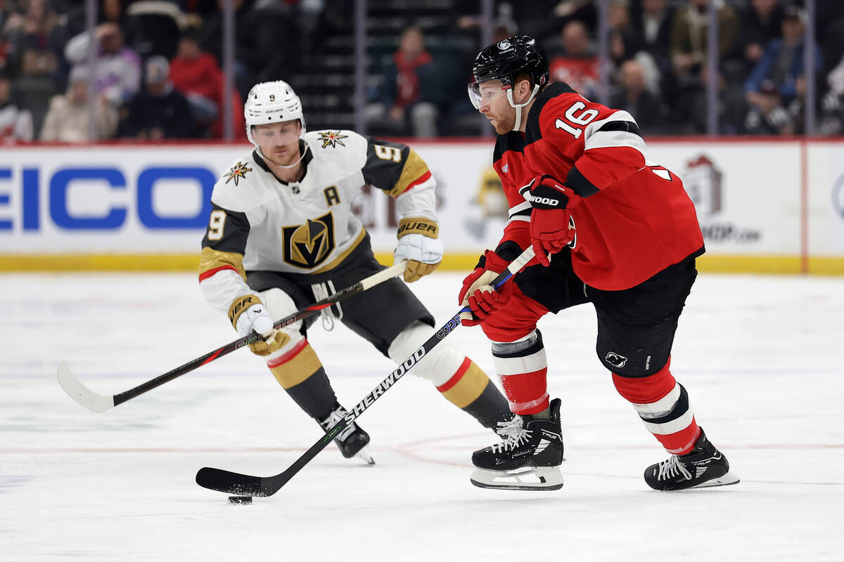 New Jersey Devils right wing Connor Brown (16) controls the puck in front of Vegas Golden Knigh ...