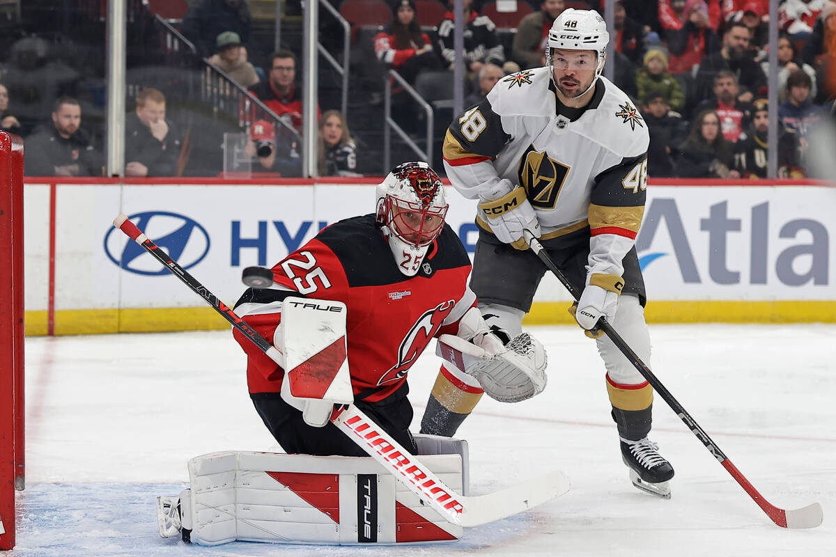 New Jersey Devils goaltender Jacob Markstrom and Vegas Golden Knights center Tomas Hertl (48) w ...