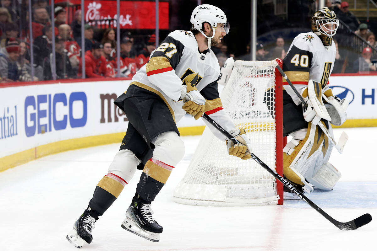 Vegas Golden Knights defenseman Shea Theodore (27) skates with the puck during the second perio ...