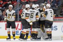 Vegas Golden Knights goaltender Akira Schmid, second from right, is congratulated by teammates ...