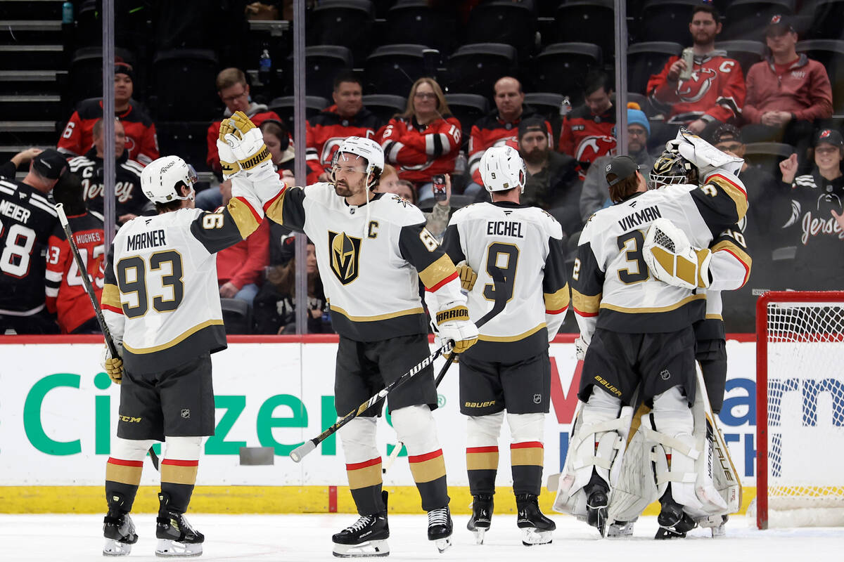 Vegas Golden Knights right wing Mark Stone (61) high-fives right wing Mitch Marner (93) after t ...