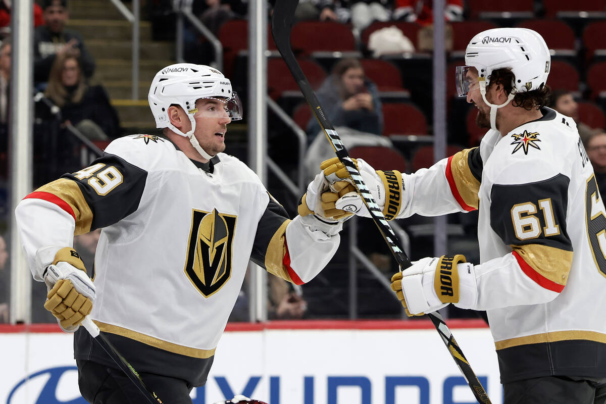 Vegas Golden Knights left wing Ivan Barbashev (49) is congratulated by Mark Stone (61) after sc ...