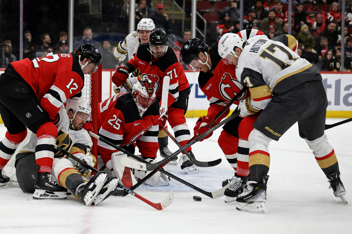 New Jersey Devils goaltender Jacob Markstrom (25) defends his net against Vegas Golden Knights ...