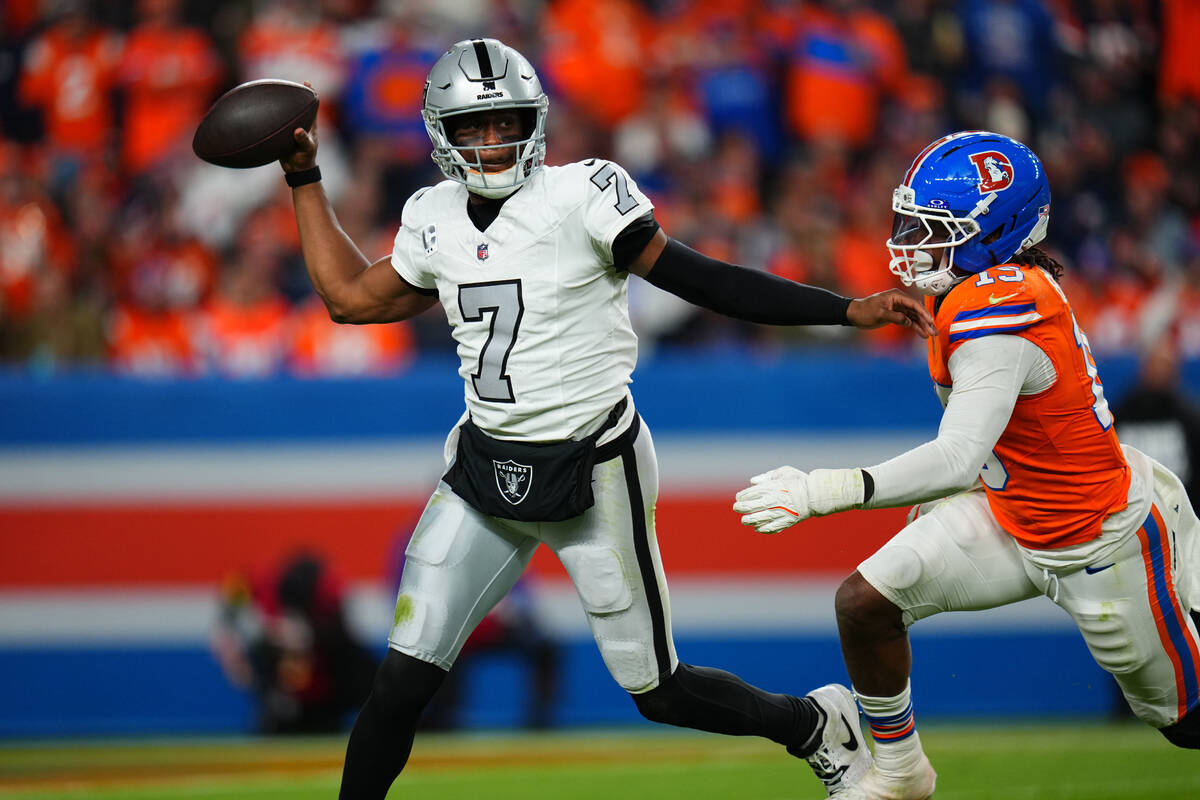 Las Vegas Raiders quarterback Geno Smith (7) throws under pressure from Denver Broncos lineback ...