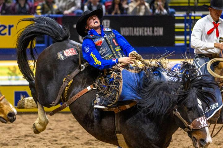 Stetson Wright rides Bugsy in Saddle Bronc Riding during Day 2 of National Finals Rodeo at the ...