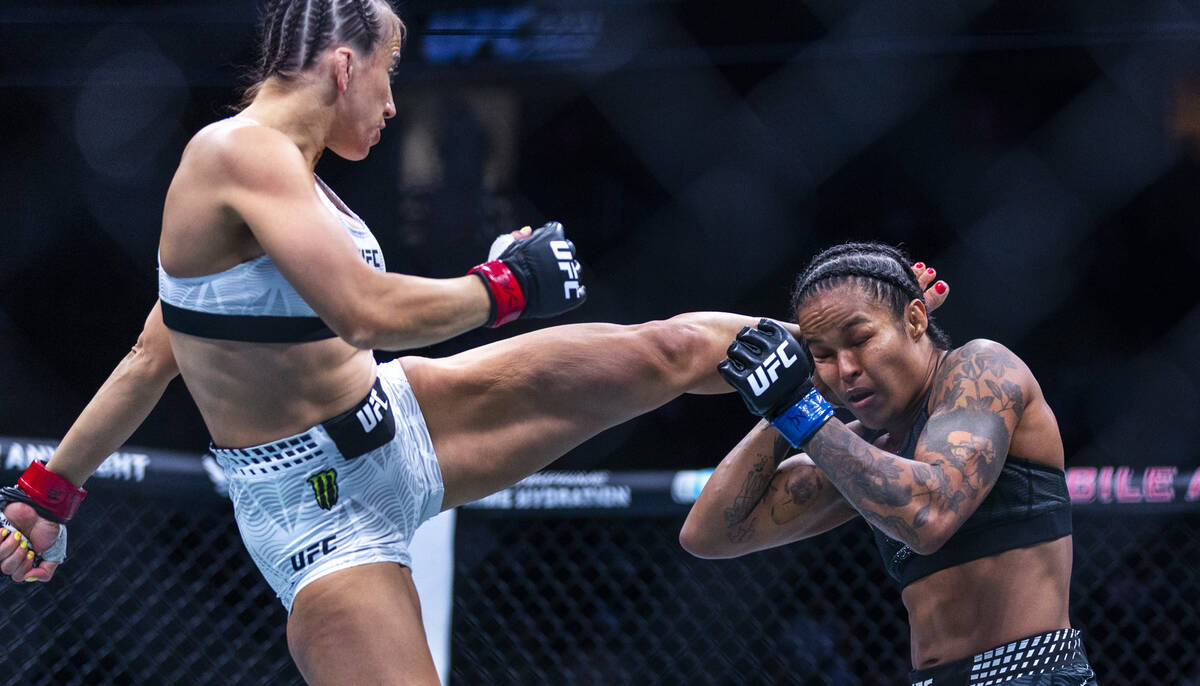 Maycee Barber connects with a kick to the head of Karine Silva during their women’s flyw ...