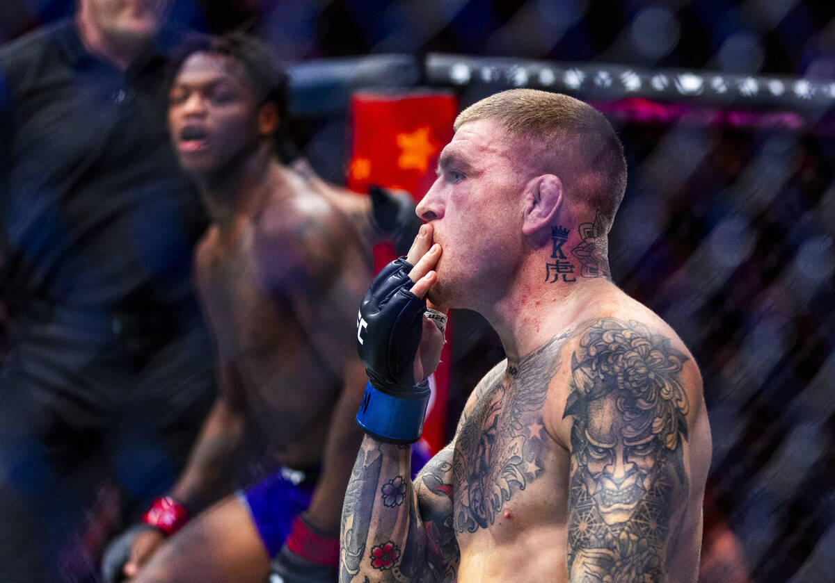 Chris Duncan is overcome with his quick defeat of Terrance McKinney during their lightweight fi ...