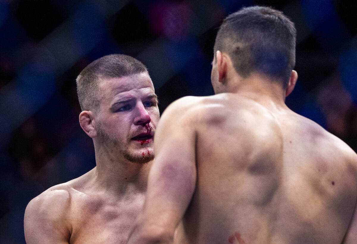 Grant Dawson talks with Manuel Torres after a Torres win during their lightweight fight in UFC ...