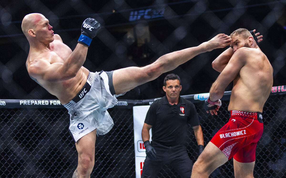 Bogdan Guskov just connects with the forehead of Jan Blachowicz during their light heavyweight ...