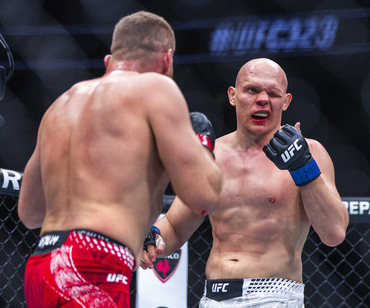 Bogdan Guskov signals that Jan Blachowicz poked him in the eye during their light heavyweight f ...