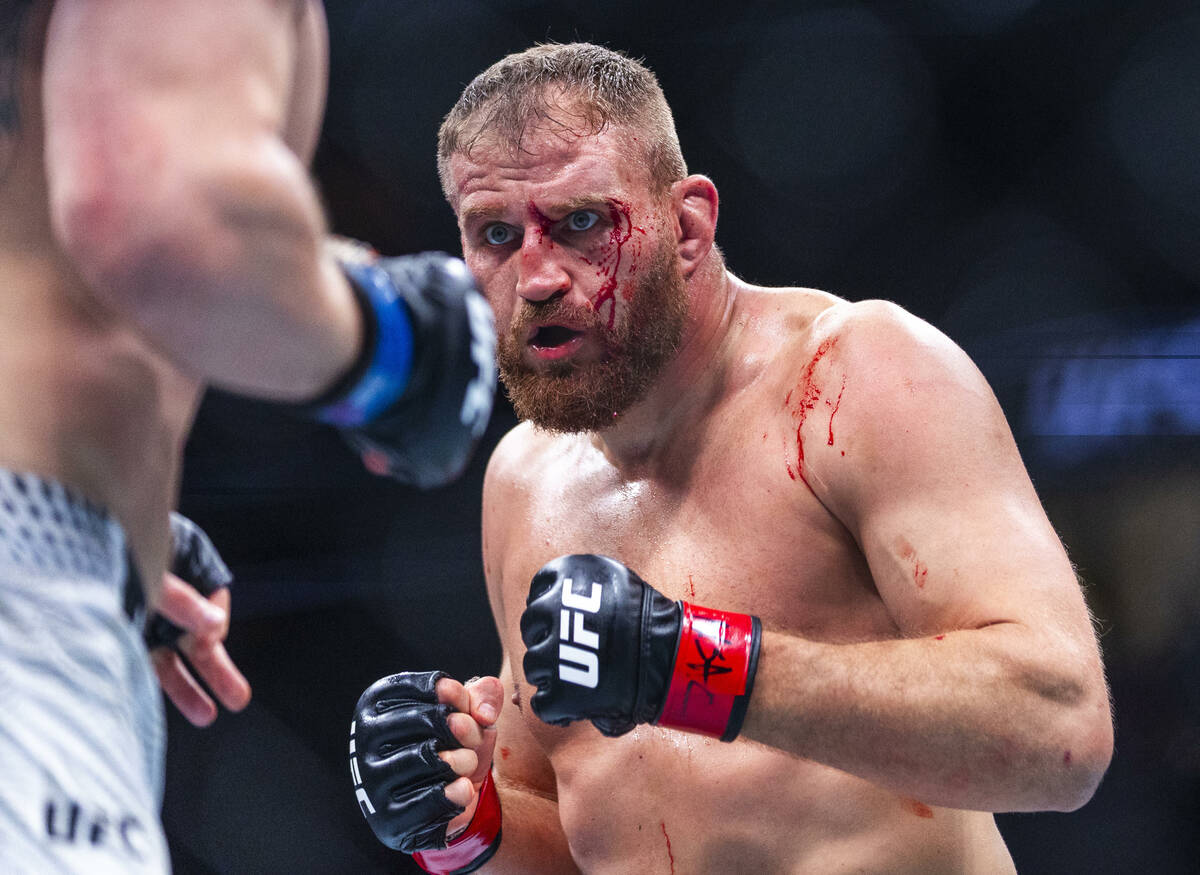 Jan Blachowicz is bloodied but advances on Bogdan Guskov during their light heavyweight fight i ...