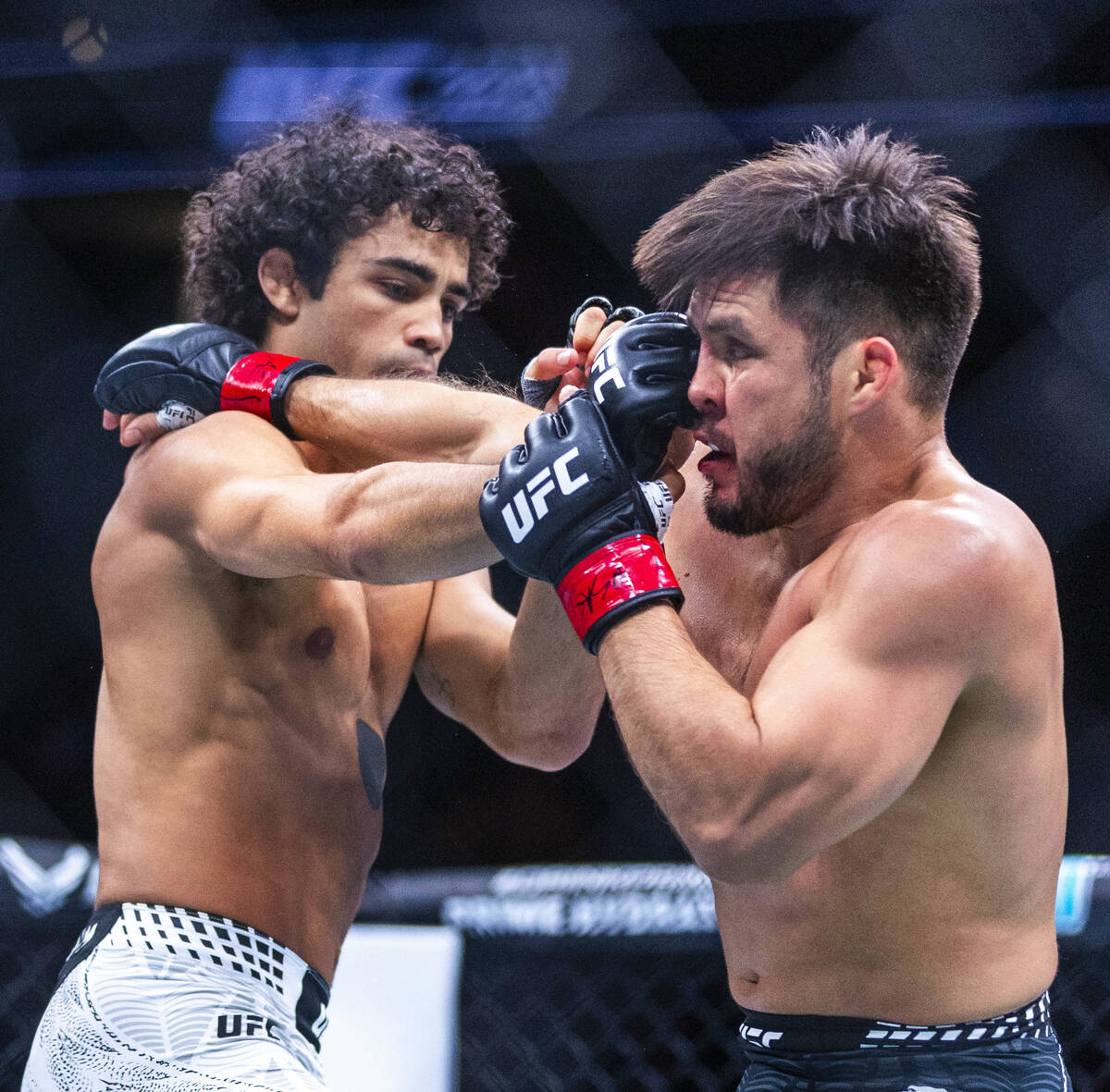 Payton Talbott connects with a shot to the face of Henry Cejudo during their bantamweight fight ...