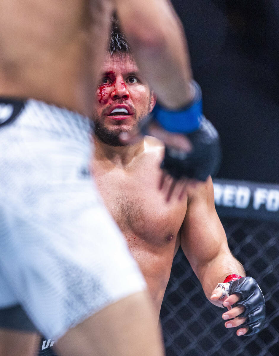 Henry Cejudo is bloodied but not out against Payton Talbott during their bantamweight fight in ...