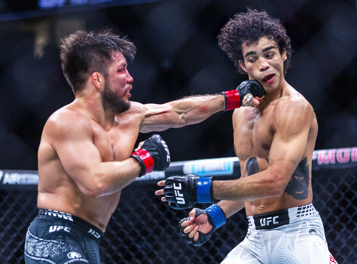 Henry Cejudo connects with the chin of Payton Talbott during their bantamweight fight in UFC 32 ...