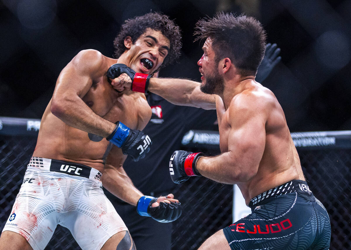 Payton Talbott takes shot from Henry Cejudo during their bantamweight fight in UFC 323 at the T ...