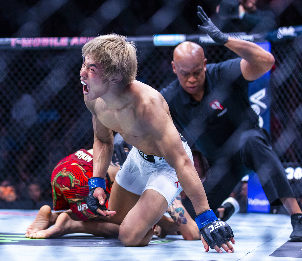 Tatsuro Taira celebrates his win over Brandon Moreno during their flyweight fight in UFC 323 at ...