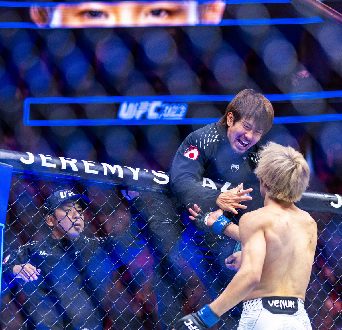 Tatsuro Taira and his team celebrate the win over Brandon Moreno during their flyweight fight i ...