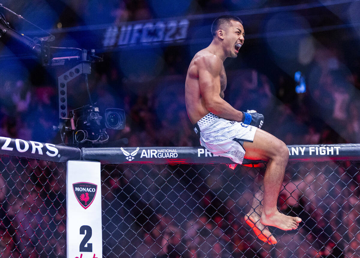 Joshua Van celebrates his victory over Alexandre Pantoja during their flyweight title fight in ...