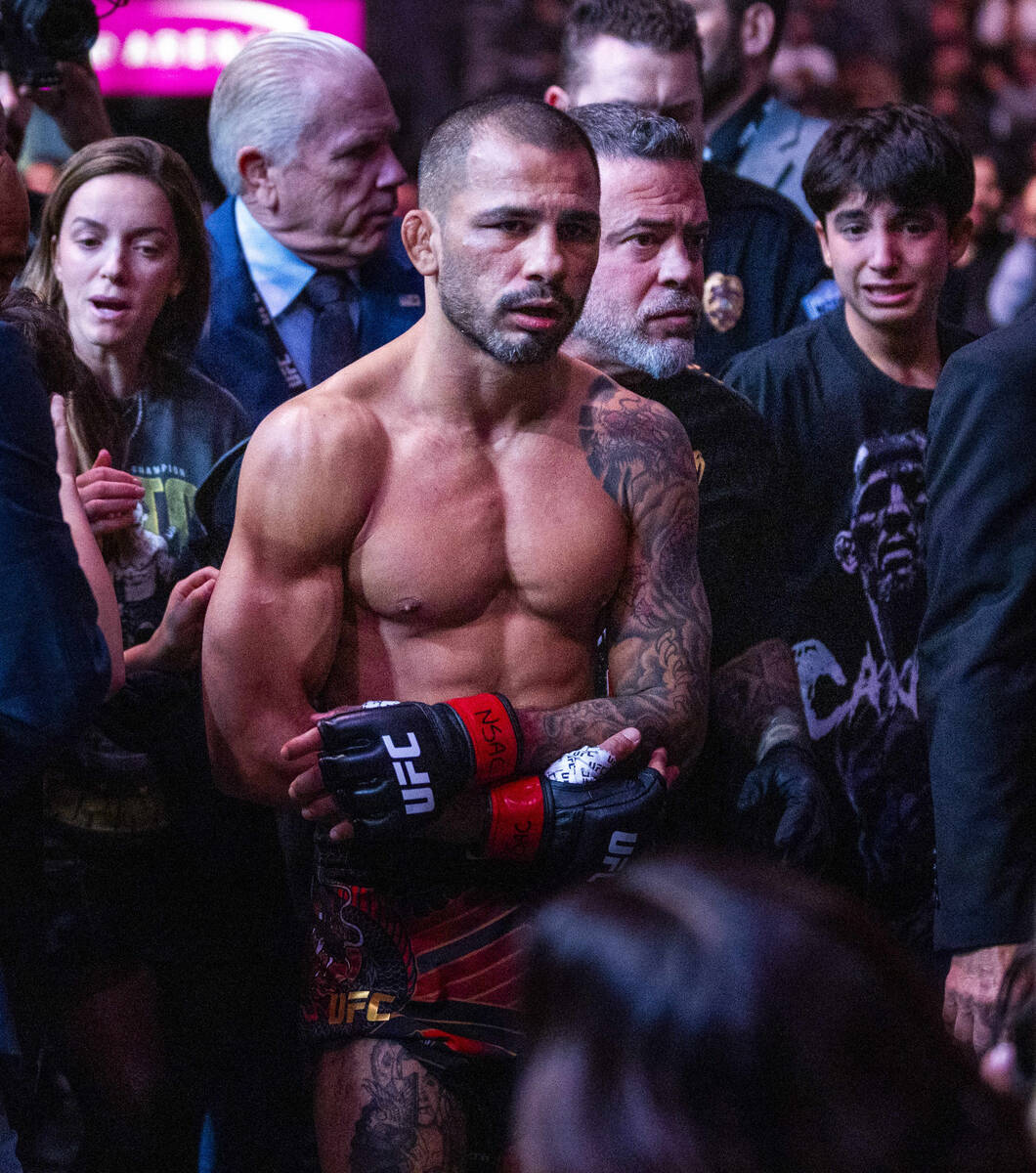 Alexandre Pantoja leaves the octagon losing to Joshua Van with an arm injury during their flywe ...