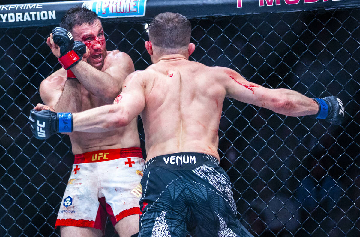 Merab Dvalishvili prepares to defend himself from a strike by Petr Yan during their bantamweigh ...