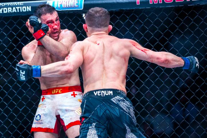 Merab Dvalishvili prepares to defend himself from a strike by Petr Yan during their bantamweigh ...