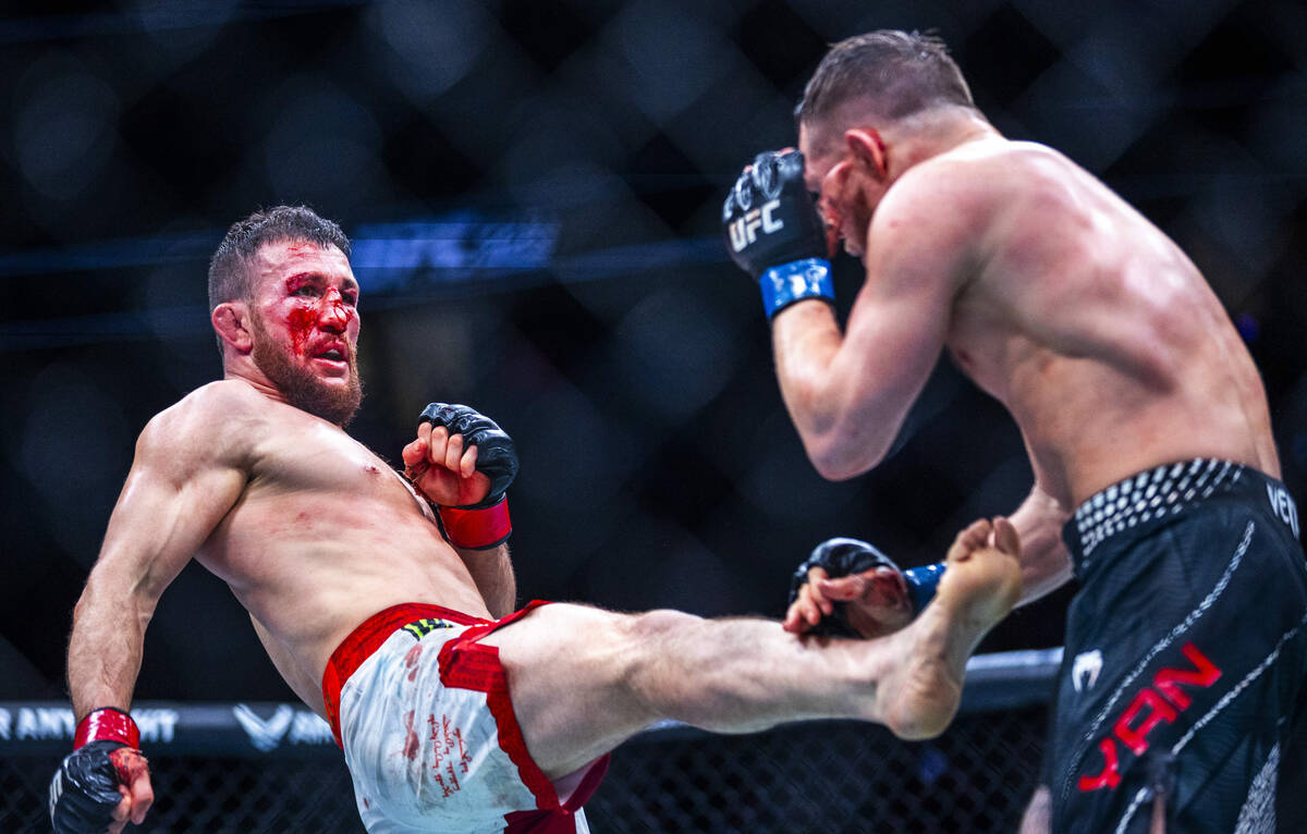 Merab Dvalishvili sends a kick at Petr Yan during their bantamweight title fight in UFC 323 at ...
