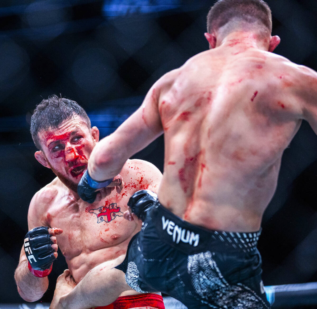 Petr Yan connects with a kick to the side of Merab Dvalishvili during their bantamweight title ...