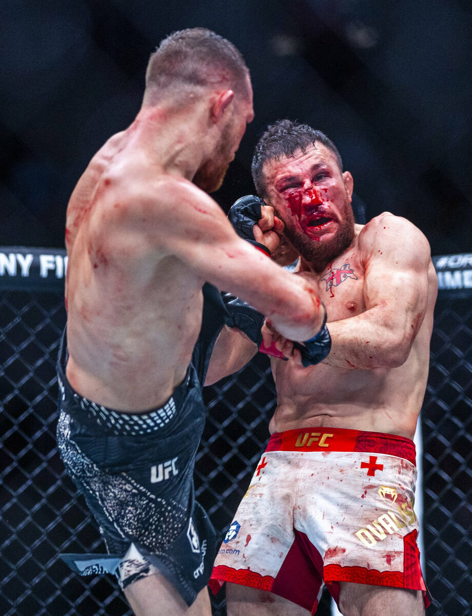 Petr Yan connects with a kick to the side of the head of Merab Dvalishvili during their bantamw ...