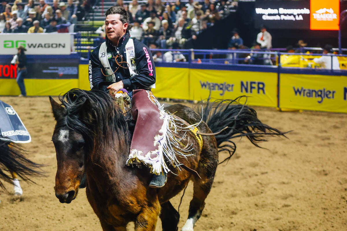 Waylon Bourgeois rides Little Bug on day four of the National Finals Rodeo at the Thomas & ...