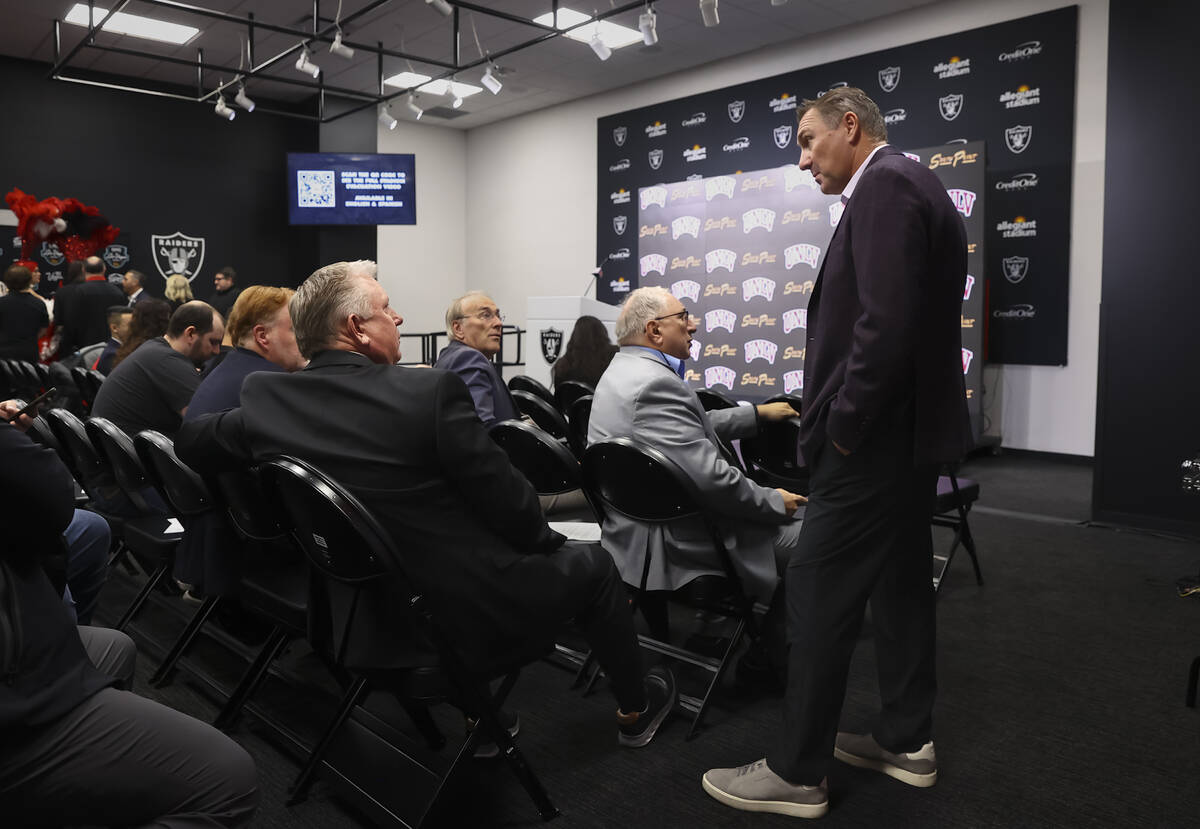 UNLV football coach Dan Mullen talks with reporters while waiting to find out the team’s ...