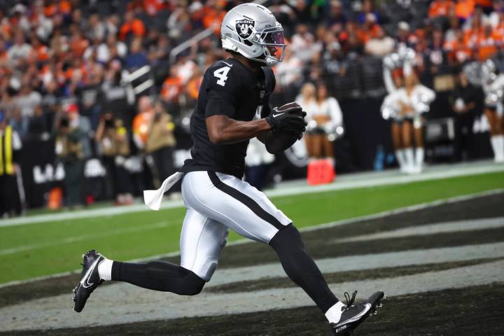 Raiders wide receiver Shedrick Jackson (4) scores a touchdown against the Denver Broncos during ...