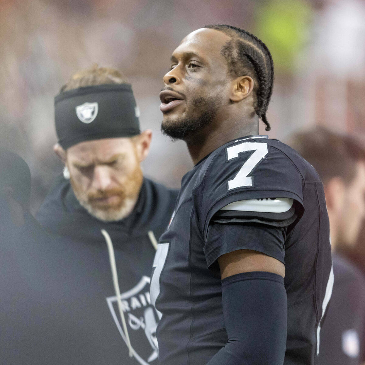 Raiders quarterback Geno Smith (7) responds to a fan from the bench during the second half of a ...