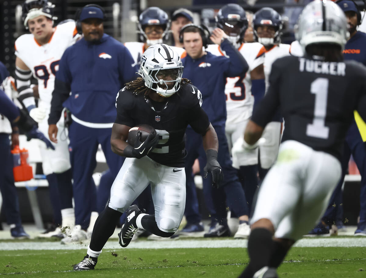 Raiders running back Ashton Jeanty (2) runs the ball against the Denver Broncos during the firs ...