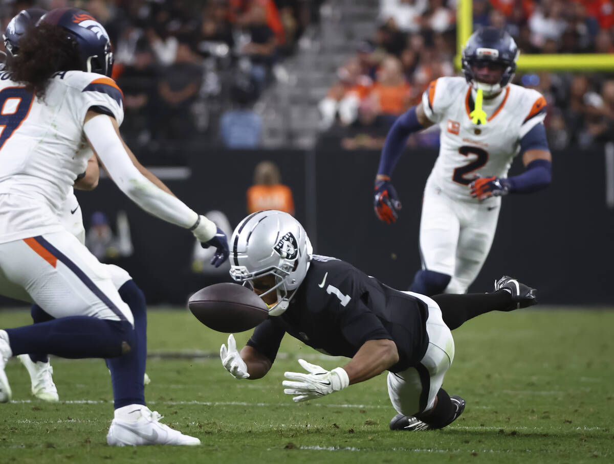 Raiders wide receiver Tre Tucker (1) misses a pass from quarterback Geno Smith, out of frame, u ...