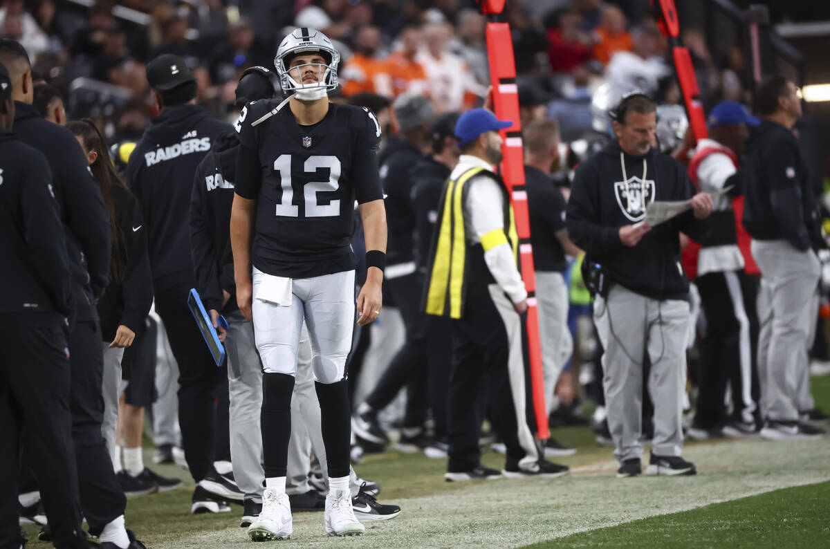 Raiders quarterback Aidan O'Connell (12) looks on during the second half of an NFL game ag ...